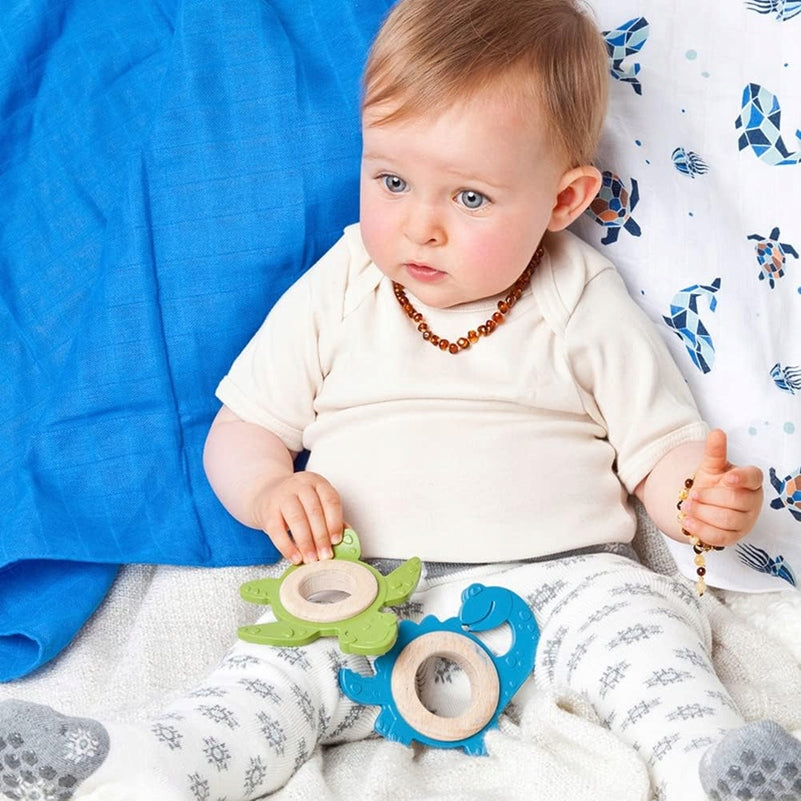 GRUNSPECHT μασώμενη οδοντοφυΐα DINO από καουτσούκ και ξύλο 9 x 11 cm 3 m+