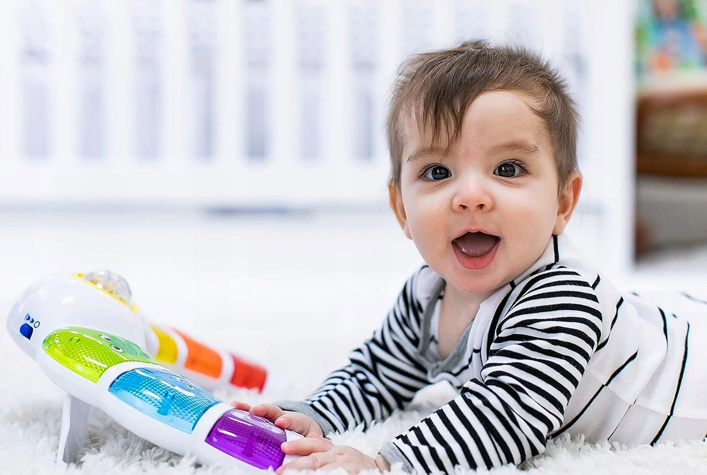 BABY EINSTEIN panel świetlny z grzechotką, melodiami i słowami w 3 językach