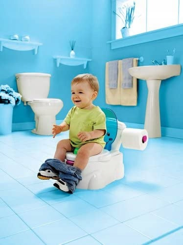 FISHER PRICE nocnik Moja Pierwsza Toaleta DE interaktywny nocnik dla dziecka 18 m+ z dźwiękami i piosenkami